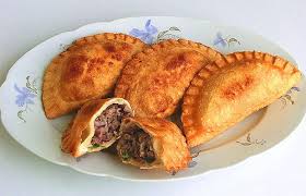 Chebureki (Чебуреки) - Crispy fried pastries filled with juicy spiced meat. A beloved street food treat.
