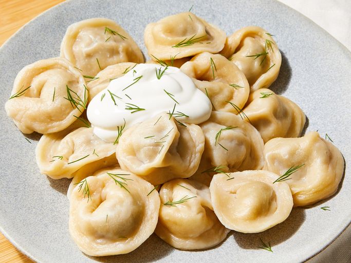 Pelmeni (Пельмени) - Siberian meat dumplings served in broth or with butter. Comfort food at its finest.