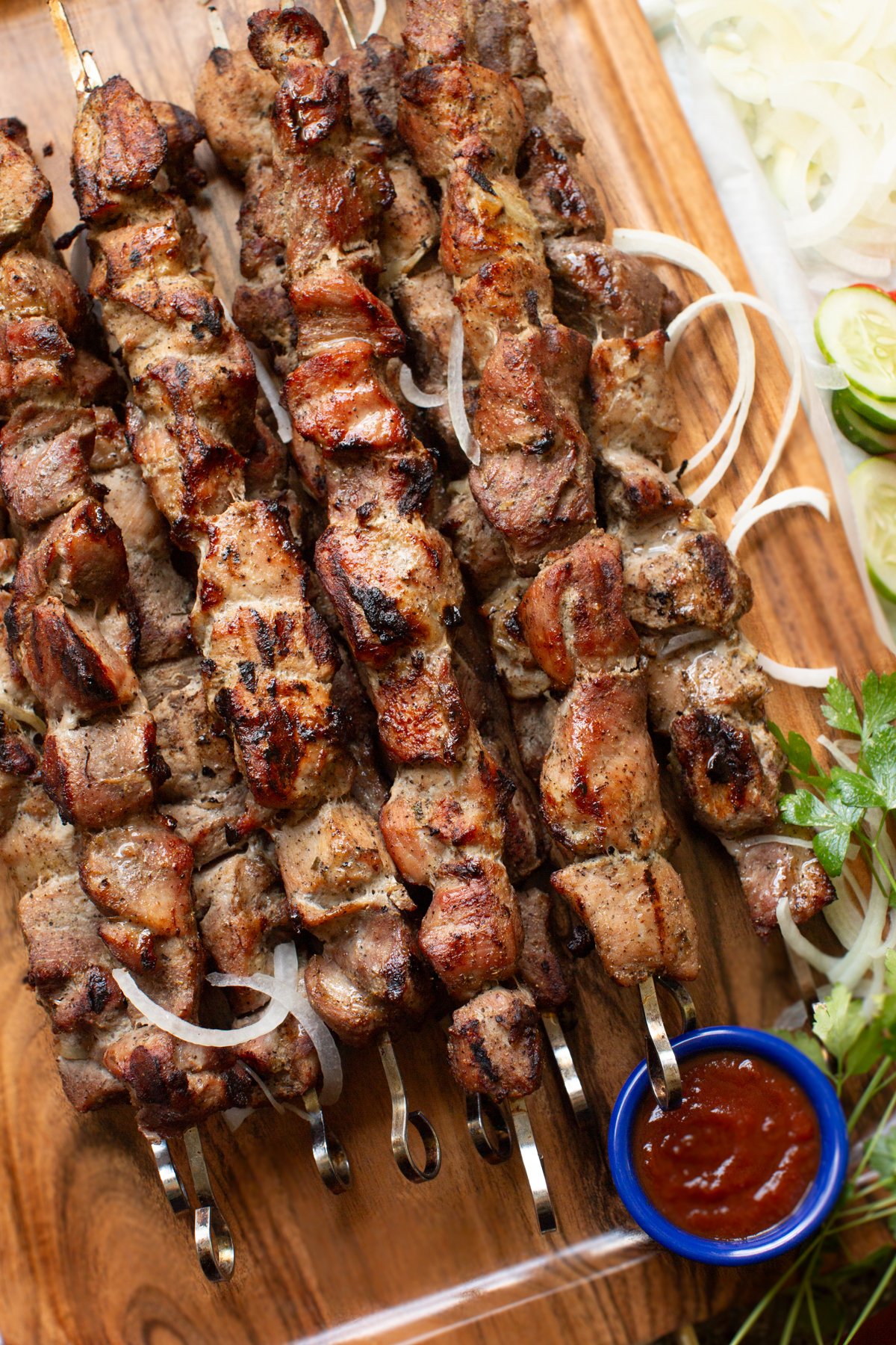 Shashlik (Шашлык) - Marinated meat kebabs grilled over open fire. The ultimate outdoor cooking experience.